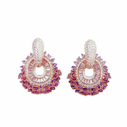 Rose gold-colored earrings with pink zirconias