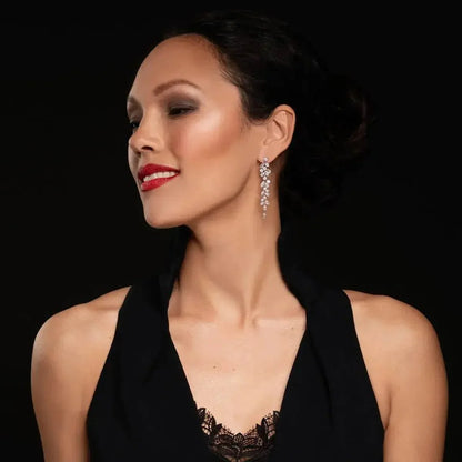 Gold-colored leaf dance earrings with zirconia