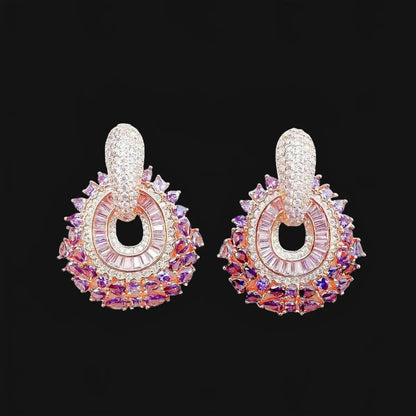 Rose gold-colored earrings with pink zirconias